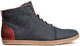A pair of trainer shoes in grey with laces and a canvas heel.